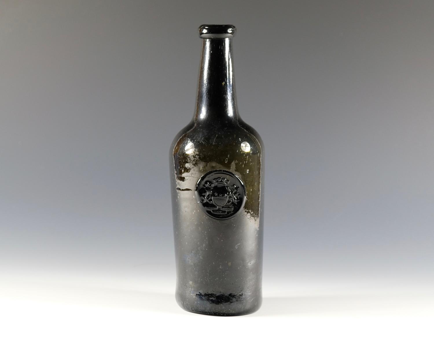 Olive green wine bottle bearing a seal of the Clive Arms C1780