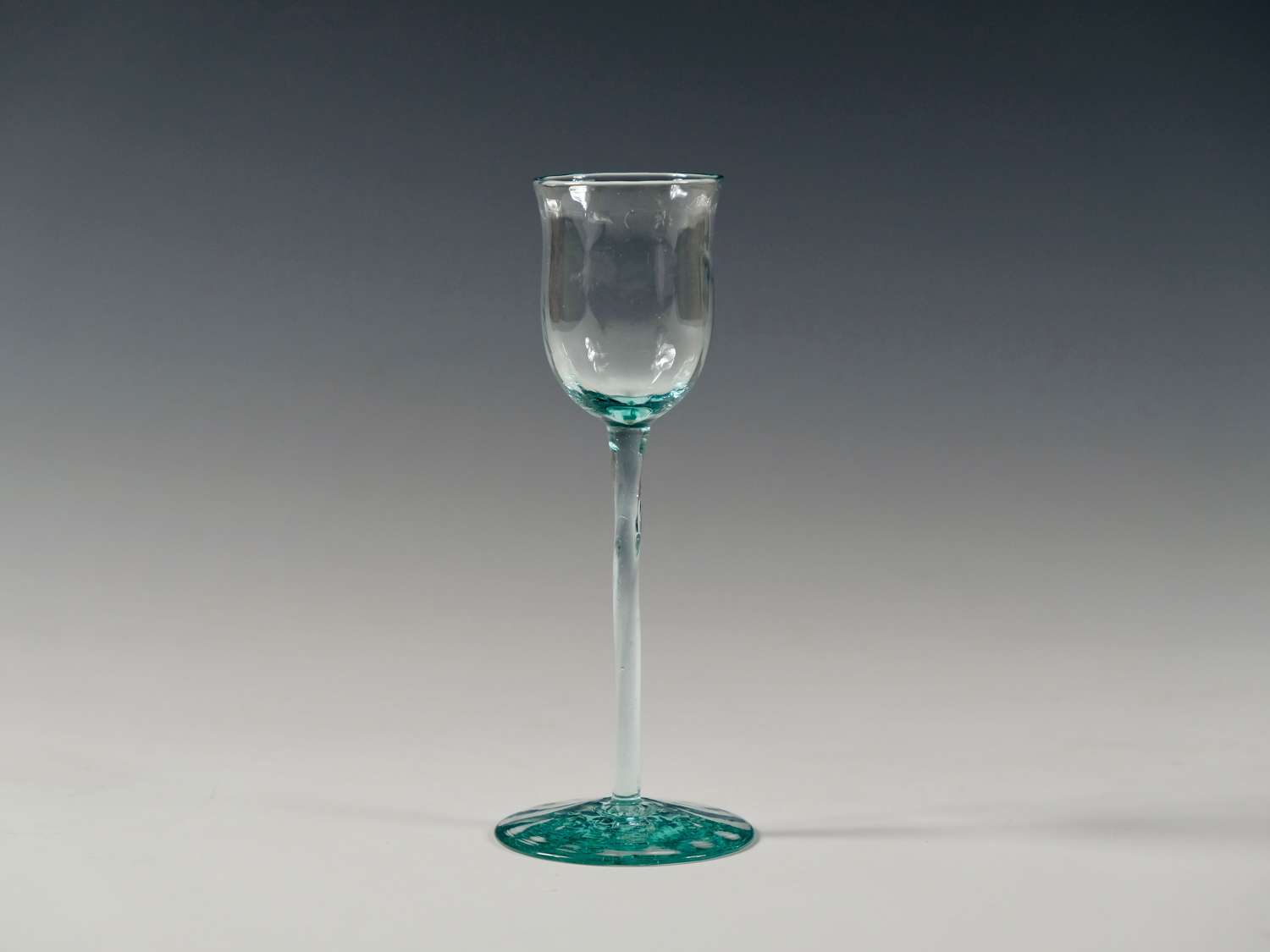 Liqueur glass in pale blue with twisted stem and optical ribbing C1900
