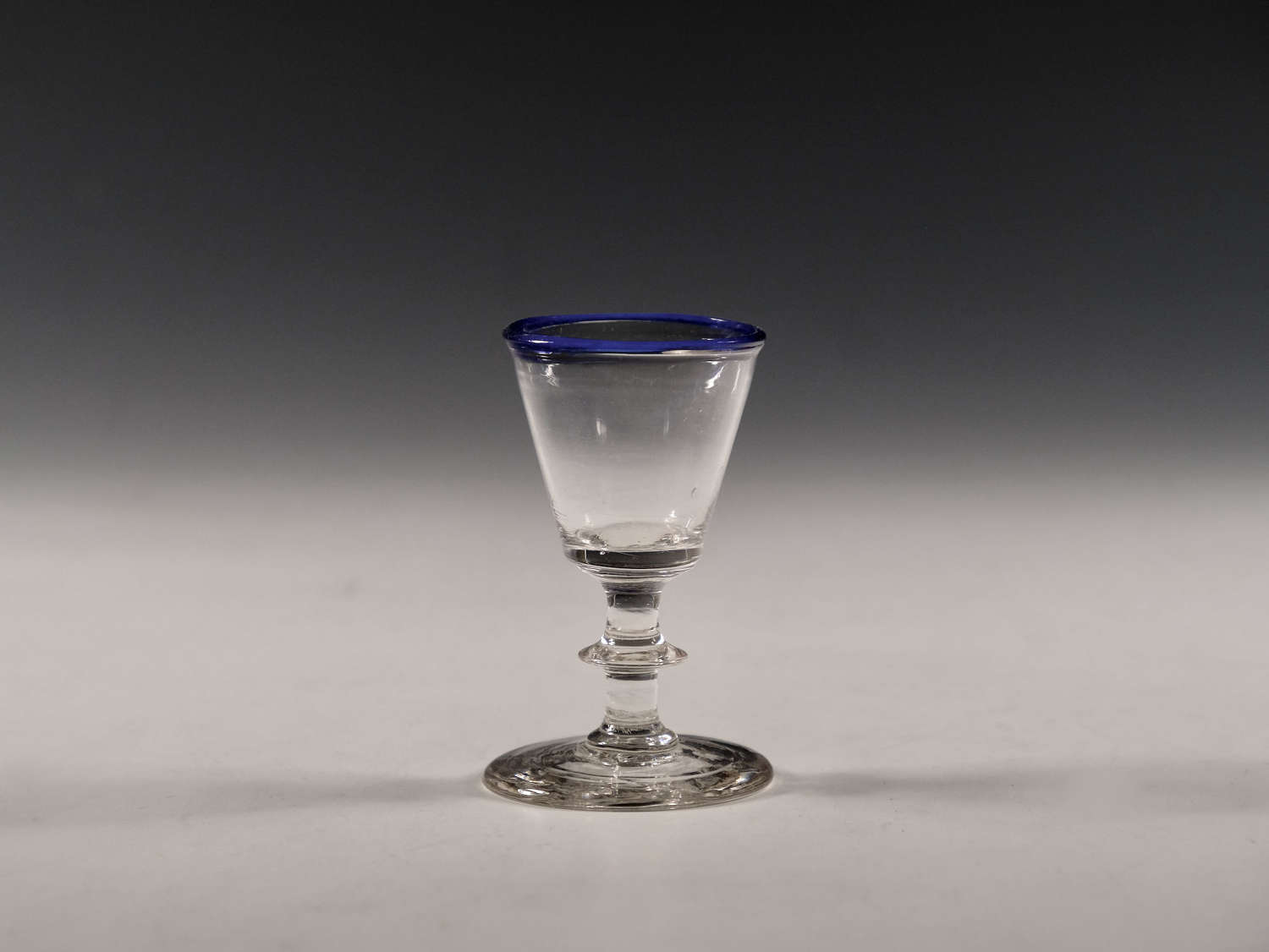 Antique glass dram with blue rim English c1820