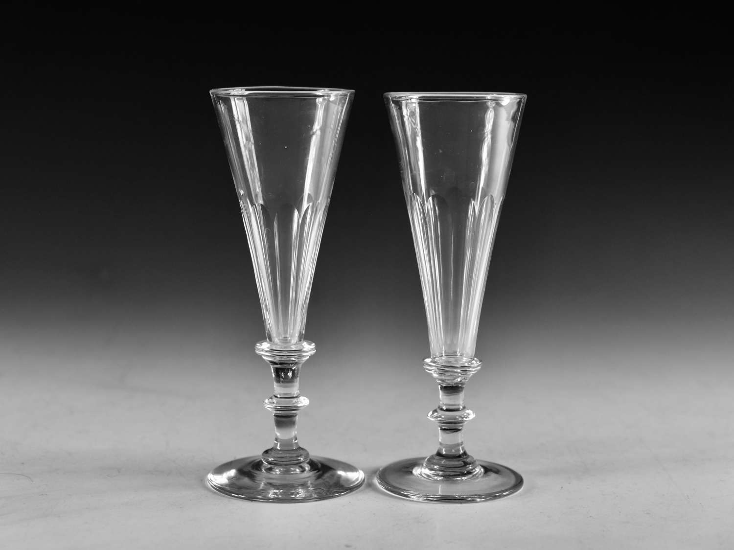 Antique glass - near pair of champagne flutes English c1830